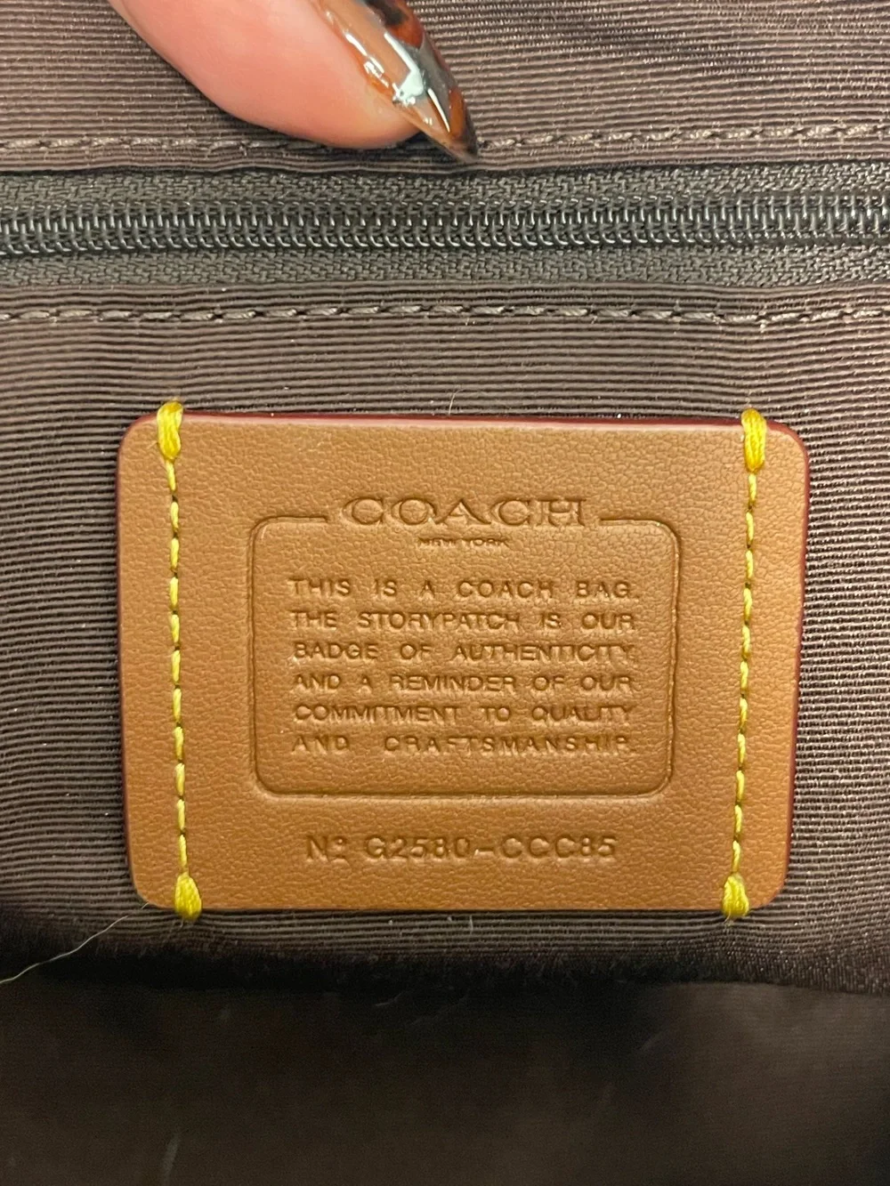 Coach asher cow print